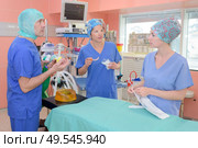 satisfied team of surgeons after surgery. Стоковое фото, агентство Ingram Publishing / Фотобанк Лори