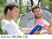 friends with different leisure at campsite. Стоковое фото, агентство Ingram Publishing / Фотобанк Лори