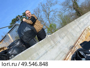 recycling garbage collector truck loading waste and trash bin. Стоковое фото, агентство Ingram Publishing / Фотобанк Лори