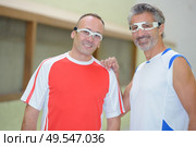 portrait of men playing pala. Стоковое фото, агентство Ingram Publishing / Фотобанк Лори