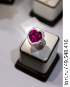 jewelry retail store showcase displaying white gold ring  with precious  gemstones. ring with huge turmaline and diamonds. close up. Стоковое фото, агентство Ingram Publishing / Фотобанк Лори