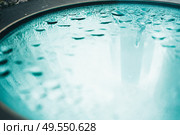 Abstract image of raindrops over a glass. Стоковое фото, агентство Ingram Publishing / Фотобанк Лори