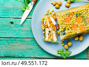 Jellied, cold dish of fish, filled with gelatinous broth.Russian national cuisine. Fish aspic on plate. Стоковое фото, агентство Ingram Publishing / Фотобанк Лори