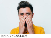man laughs and covers her mouth. Стоковое фото, агентство Ingram Publishing / Фотобанк Лори
