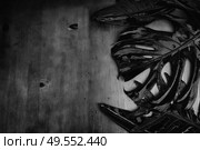Summer flat lay border with minamalist black tropical leaves with copy space. Summer flat lay scenery. Стоковое фото, агентство Ingram Publishing / Фотобанк Лори
