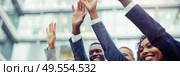 A diverse group of individuals raising their hands in unison as a gesture of unity, solidarity, and celebration. Стоковое AI-изображение, AI-художник Данила Большаков / Фотобанк Лори