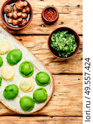 Homemade diet ravioli stuffed with spinach and nettle.Dumplings with herbal filling.. Ravioli with nettle. Стоковое фото, агентство Ingram Publishing / Фотобанк Лори