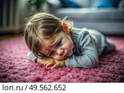 A little girl is lying on the floor. Childish hysteria. The child screams, sobs, gets cranky and gets hysterical. Discontent. Стоковое AI-изображение, AI-художник Photojuli / Фотобанк Лори