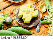 Traditional sweet oriental halva dessert.Diet halva or halvah. Oriental halva with nuts. Стоковое фото, агентство Ingram Publishing / Фотобанк Лори