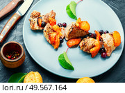 Baked meat in red wine with apricot and blackcurrant.Stewed pork.. Stew meat with apricot. Стоковое фото, агентство Ingram Publishing / Фотобанк Лори