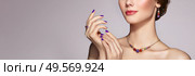 Portrait Beautiful Woman with Jewelry. Model Girl with Violet Manicure on Nails. Elegant Hairstyle.  Beauty and Accessories. Стоковое фото, агентство Ingram Publishing / Фотобанк Лори