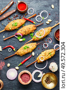 Juicy lula kebab made from meat.Minced meat on the grill. Lula kebab on stick. Стоковое фото, агентство Ingram Publishing / Фотобанк Лори