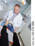 podiatrist working in clinic. Стоковое фото, агентство Ingram Publishing / Фотобанк Лори
