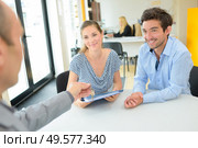 young couple meeting with realtor. Стоковое фото, агентство Ingram Publishing / Фотобанк Лори