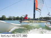 enjoying extreme sailing with racing sailboat. Стоковое фото, агентство Ingram Publishing / Фотобанк Лори