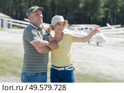 couple preparing for start in private airplane. Стоковое фото, агентство Ingram Publishing / Фотобанк Лори