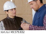 male and female workers at construction site. Стоковое фото, агентство Ingram Publishing / Фотобанк Лори