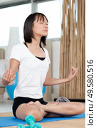 fitness woman yoga relax meditation in lotus pose at home. Стоковое фото, агентство Ingram Publishing / Фотобанк Лори