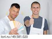 young apprentice agreeing in the choice of color. Стоковое фото, агентство Ingram Publishing / Фотобанк Лори