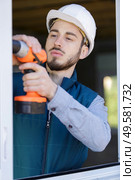 builder worker with pneumatic hammer drill perforator equipment. Стоковое фото, агентство Ingram Publishing / Фотобанк Лори