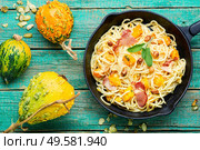 Traditional italian dish spaghetti carbonara with pumpkin and bacon.Pasta carbonara.Pasta with baked pumpkin. Pasta with pumpkin and bacon. Стоковое фото, агентство Ingram Publishing / Фотобанк Лори