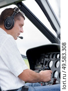 portrait of pilot in helicopter. Стоковое фото, агентство Ingram Publishing / Фотобанк Лори