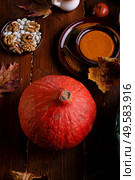 ripe pumpkin served  at wooden rural brown table. cooking recipe. healthy life concept. Стоковое фото, агентство Ingram Publishing / Фотобанк Лори