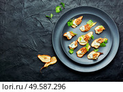 Dry pear,blue cheese and walnut appetizer.Space for text. Blue cheese with dried pears and walnuts. Стоковое фото, агентство Ingram Publishing / Фотобанк Лори