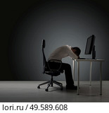 Exhausted businessman having a nap on the desk. Стоковое фото, агентство Ingram Publishing / Фотобанк Лори