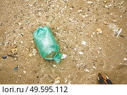 Plastic and microplastic in the sand beach. Стоковое фото, агентство Ingram Publishing / Фотобанк Лори