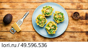 Plate with cheese basket with avocado,cowpea and nuts.Banquet,holiday food. Cheese basket stuffed with vegetables. Стоковое фото, агентство Ingram Publishing / Фотобанк Лори