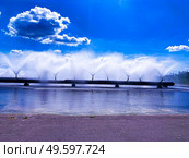 Colorful sight: cooling fountains of the Atomic Station, Heat of a power plant against a background of white clouds and blue sky.. Colorful sight: cooling fountains of the Atomic Station, Heat of a power plant against a background of white clouds, blue sky. Стоковое фото, агентство Ingram Publishing / Фотобанк Лори