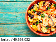 Oriental dessert made from baked fruits,berries and suluguni cheese. Baked fruits,berries with cheese,copy space. Стоковое фото, агентство Ingram Publishing / Фотобанк Лори