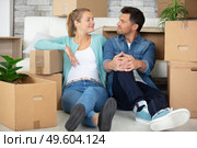 satisfied couple sat amongst cardboard boxes. Стоковое фото, агентство Ingram Publishing / Фотобанк Лори