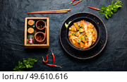 Tom yam kung spicy thai seafood soup in bowl. Tom yum soup with seafood and coconut milk. Стоковое фото, агентство Ingram Publishing / Фотобанк Лори