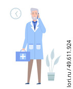 Medical clinic worker is holding first aid kit. Emergency doctor is talking on a mobile phone. Paramedic prepares to go on emergency call. Man in blue uniform stands and waits for a patient. Medical clinic worker holding first aid kit. Emergency doctor doctor is talking on a cell phone. Стоковая иллюстрация, агентство Ingram Publishing / Фотобанк Лори