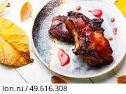 Pork steak roasted with berry sauce.Fried meat in viburnum syrup. Steak with autumn berries. Стоковое фото, агентство Ingram Publishing / Фотобанк Лори