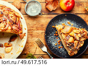 Autumn pie with apples, nuts and sea buckthorn. Charlotte on kefir.. Delicious apple pie, charlotte. Стоковое фото, агентство Ingram Publishing / Фотобанк Лори