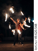 light up the night fire show with the participation of the people, light, and open fire. Стоковое фото, агентство Ingram Publishing / Фотобанк Лори