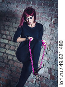 girl model in black with pink hair in an abandoned building. Стоковое фото, агентство Ingram Publishing / Фотобанк Лори