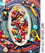 Beads for making decoration. Set of bright colorful beads. Handmade, bijouterie. Beads for fashion jewelry. Стоковое фото, агентство Ingram Publishing / Фотобанк Лори
