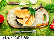 Chebureks making yeast dough, stuffing with minced beef. Delicious appetizing, chebureks. Стоковое фото, агентство Ingram Publishing / Фотобанк Лори