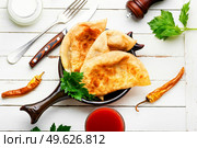 Chebureks, fried crescent-shaped cakes with meat filling. Crimean Tatar cuisine. Delicious appetizing, chebureks. Стоковое фото, агентство Ingram Publishing / Фотобанк Лори