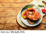 Delicious baked trout or salmon steak on pineapple. Space for text. Delicious grilled salmon with pineapple. Стоковое фото, агентство Ingram Publishing / Фотобанк Лори
