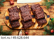Panforte, delicious Christmas treat made from dried fruits and nuts. Panforte is an Christmas torte.. Panforte, Italian Christmas pastries. Стоковое фото, агентство Ingram Publishing / Фотобанк Лори