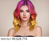 Beauty Fashion Model Woman with Colorful Dyed Hair. Girl with Perfect Makeup and Hairstyle. Model with Perfect Healthy Dyed Hair. Care and Beauty Hair Products. Стоковое фото, агентство Ingram Publishing / Фотобанк Лори