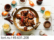 Vinegar marinated pork stewed in Indian spices, vindaloo.. Pork vindaloo, a popular Indian dish. Стоковое фото, агентство Ingram Publishing / Фотобанк Лори