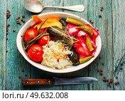 Set of pickles from tomato, sauerkraut, okra, cucumbers and cowpea. Pickles vegetable on wooden table. Homemade pickles, salty vegetables. Стоковое фото, агентство Ingram Publishing / Фотобанк Лори