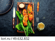 Grilled chicken breast on stick. Chicken skewers with peanut sauce. Kebab. Chicken breast skewers, chicken satay. Стоковое фото, агентство Ingram Publishing / Фотобанк Лори