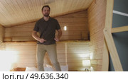 Handsome bearded man dance, have fun at home listens song, moves to music, feels overjoyed, celebrate good news, relish carefree life looks happy. Young adult male twirls, grooves. Brutal man dancer. Стоковое видео, видеограф Марина Демидюк / Фотобанк Лори